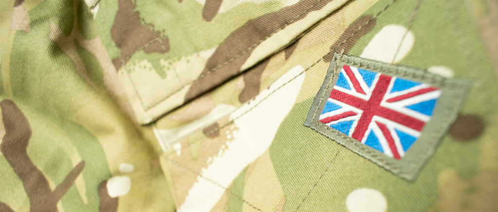 Union flag badge on a British army camouflage uniform.
