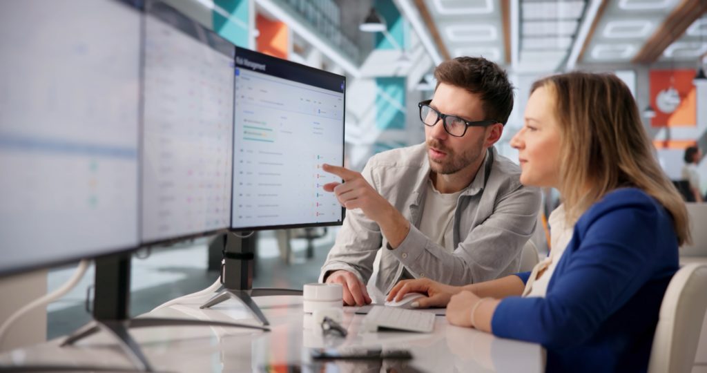 IT provider explaining security controls on monitoring screens